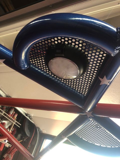 1992 Jeep Wrangler - Close-up of an interior light fixture attached to a custom roll cage structure.
