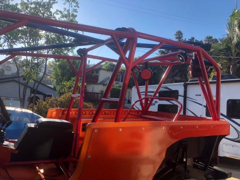 1992 Jeep Wrangler - This vehicle features an extensive custom roll cage, suggesting it's built for off-road use.