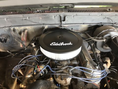 1978 Ford Bronco - Engine bay detail with an aftermarket Edelbrock air cleaner installed.