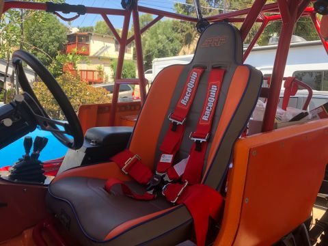 1992 Jeep Wrangler - This modified off-road vehicle features PRP racing seats and RaceQuip harnesses, suggesting a focus on performance and safety.