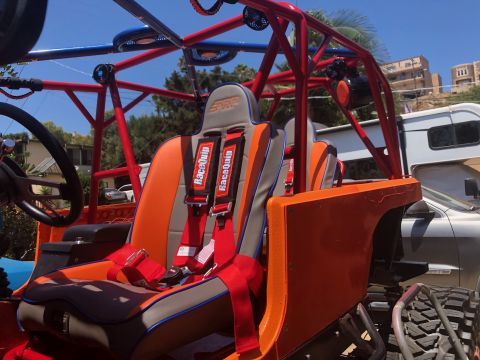 1992 Jeep Wrangler - Custom off-road buggy interior features racing seats and a prominent roll cage structure.
