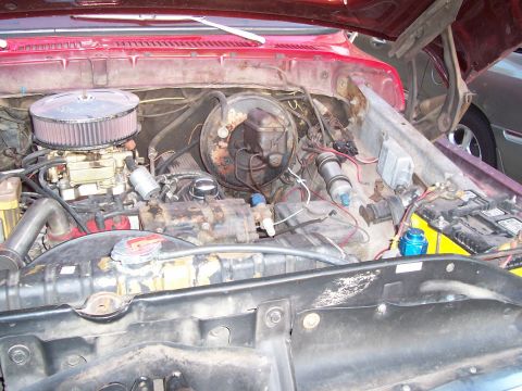 1979 Ford Bronco - Close-up view of the engine compartment, showing various mechanical components and wiring.
