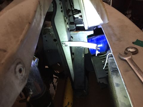 1993 Mercury Tracer - Close-up view of a vehicle's engine bay, showing a blue intercooler and a wrench resting on the fender.
