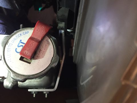 1993 Mercury Tracer - Close-up of a radiator cap with safety instructions visible on its surface.