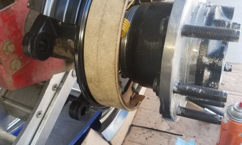 2001 Ford Excursion - A close-up view of a vehicle's brake assembly, showing the drum, shoes, and hub.