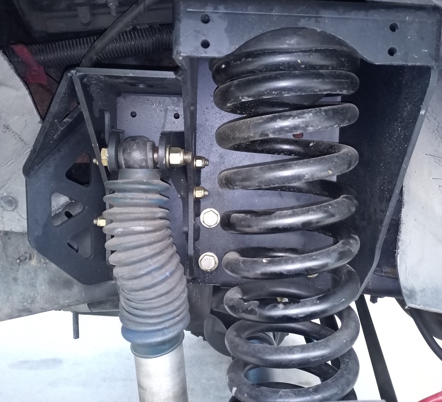 2001 Ford Excursion front suspension with black coil spring and shock absorber