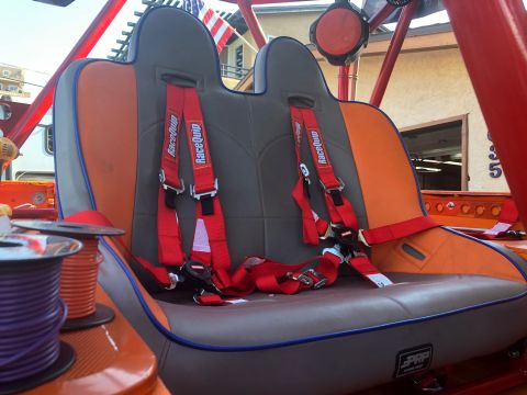 1992 Jeep Wrangler - Interior view of custom racing seats with multi-point harnesses and spools of wire.