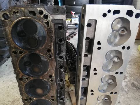1996 Ford Bronco - Comparison of a used engine cylinder head next to a newly machined one.
