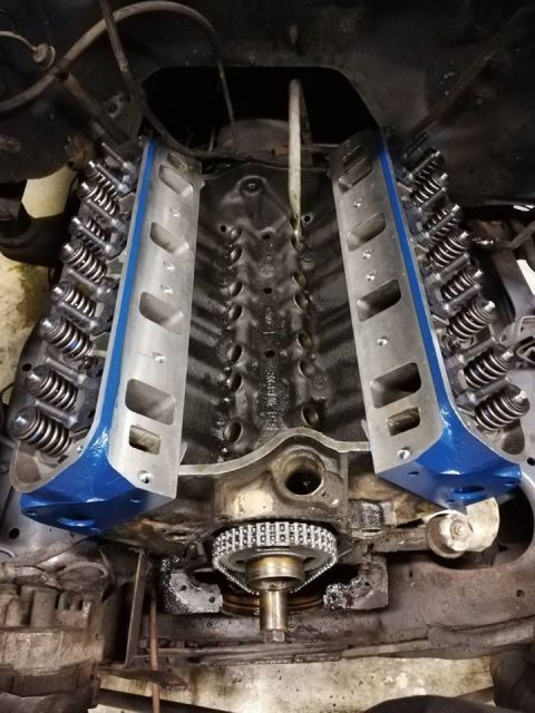 1996 Ford Bronco - Close-up view of an engine block with its valve covers removed, showing internal components.