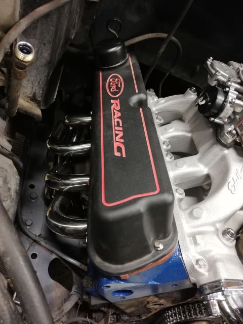 1996 Ford Bronco - Close-up of a Ford Racing valve cover installed on an engine.