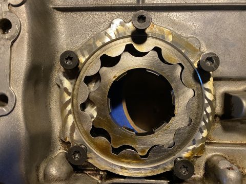 Close-up of oil pump gears with visible wear marks