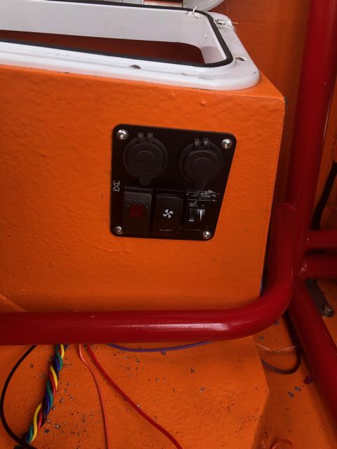 1992 Jeep Wrangler - Close-up of an orange panel showing electrical components including outlets and switches.