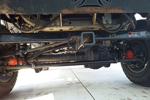 2001 Ford Excursion - Undercarriage of a heavy-duty truck, showing suspension and differential components.