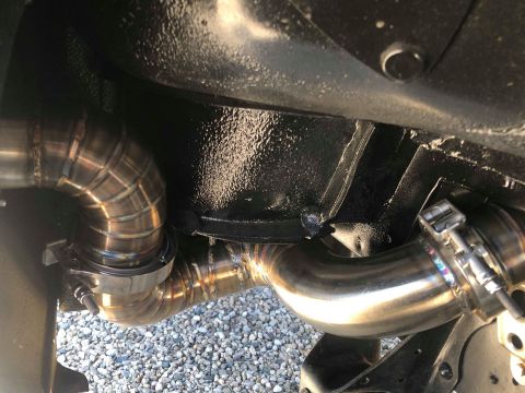 1979 Ford Bronco - Custom exhaust pipes are visible underneath a vehicle, with a Supermotors.net watermark in the corner.