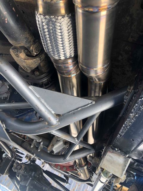 1979 Ford Bronco - Custom exhaust system components and undercarriage bracing are visible in this photo.
