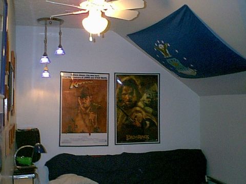 1988 Ford Bronco - Interior view of a room decorated with movie posters and a flag.