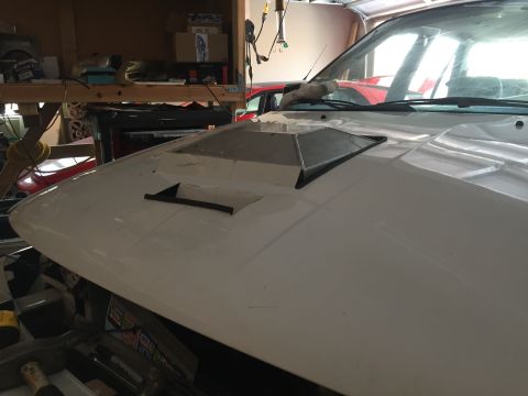 1993 Mercury Tracer - Custom hood scoop installed on a white vehicle's hood.