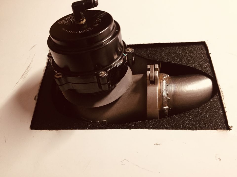 Black blow-off valve mounted on a metal pipe, with "MADE IN USA" visible on the valve