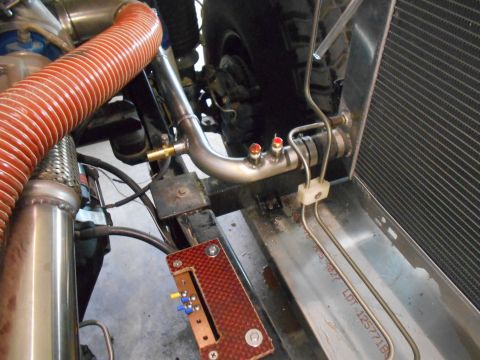 1992 Ford Bronco - Custom engine bay modifications with visible plumbing and radiator components.