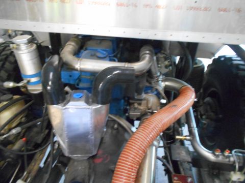 1992 Ford Bronco - Close-up view of a modified engine bay, highlighting the turbocharger and intercooler system.