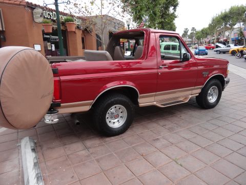 1994 Ford Bronco - This 1994 Ford Bronco features a removable top and a spare tire carrier mounted on the rear.
