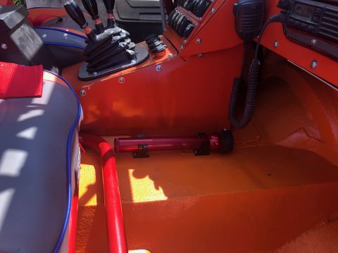 1992 Jeep Wrangler - The interior of a vehicle features orange paint, multiple switches, and a CB radio setup.