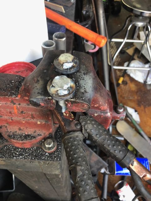 1992 Jeep Wrangler - Metal part held in vise with welding clamps and bolts.