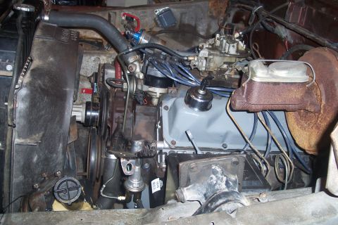 1978 Ford Bronco - Close-up of a V8 engine, likely from a 1970s vehicle, with various components visible.