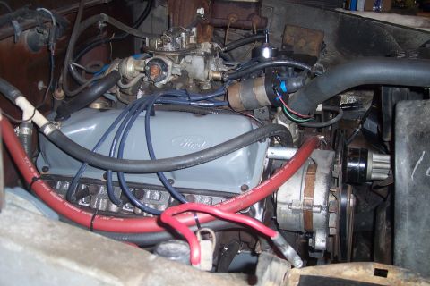 1978 Ford Bronco - The engine bay of a 1978 Ford Bronco displays its Ford-branded valve cover and various engine components.