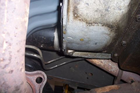 1978 Ford Bronco - Close-up of vehicle underside components, including exhaust and transmission.