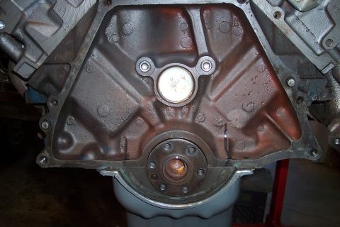 1978 Ford Bronco - Close-up of an engine block's rear seal area, with a Supermotors.net watermark.