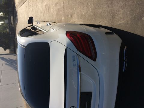 2017 Mercedes-Benz C-Class - Rear view of a white 2017 Mercedes-Benz C-Class sedan with tinted windows and chrome accents.
