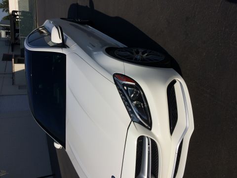 2017 Mercedes-Benz C-Class - A white sedan is viewed from the front quarter, highlighting its distinctive grille and headlight design.