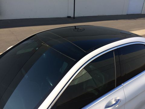 2017 Mercedes-Benz C-Class - Top view of a car's roofline, showing the sunroof and window trim.