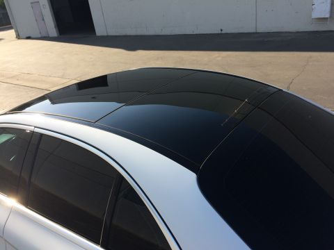 2017 Mercedes-Benz C-Class - The image shows the roof of a white car a large black panoramic sunroof.