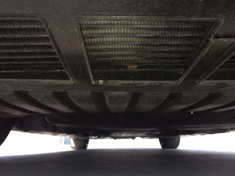 2017 Mercedes-Benz C-Class - Underside view of a vehicle, revealing radiators and undercarriage components.