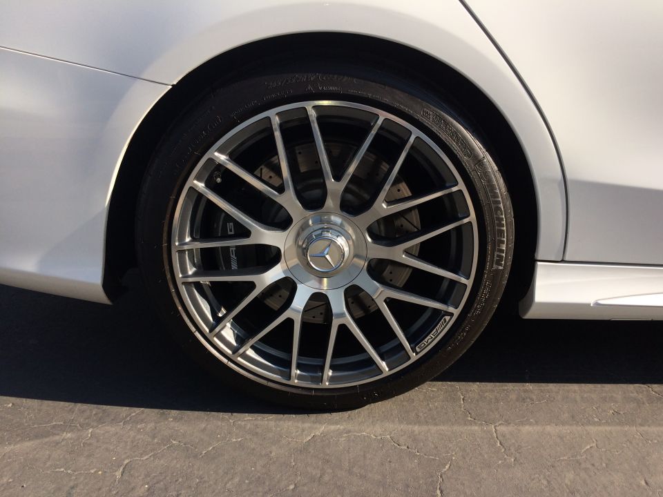 Close-up of a 2017 Mercedes-Benz C-Class wheel with AMG brake caliper