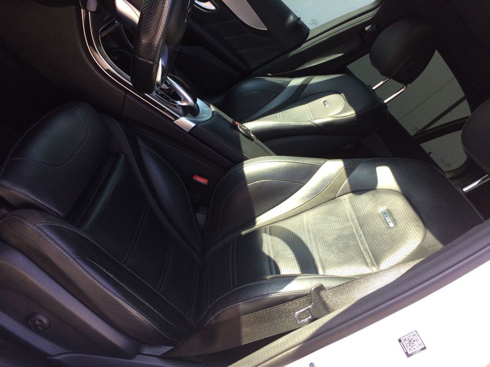 Black leather interior with perforated seats and stitching