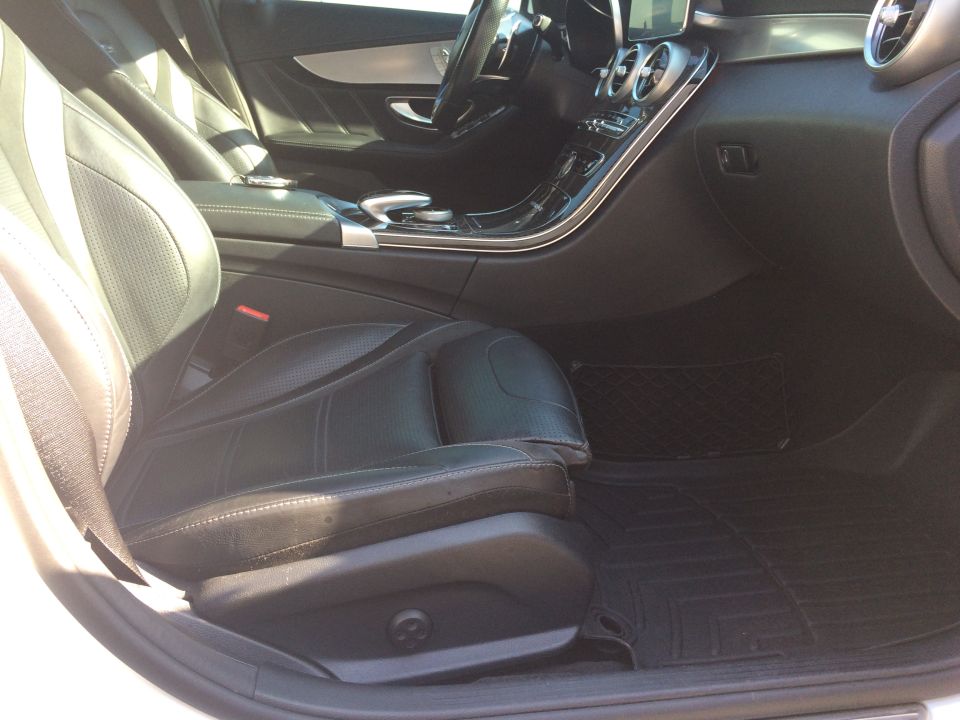 Interior view of a 2017 Mercedes-Benz C-Class showing leather seats and dashboard