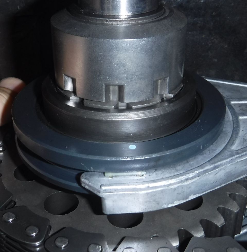 What the cog position relative to spring-loaded puck should look like if the shaft sat high enough to level the chain.