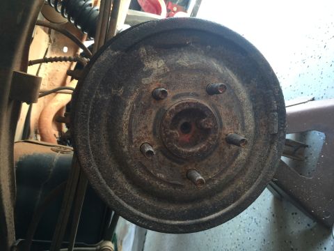 1998 Ford Ranger - This photo shows a rusty brake drum, likely from the rear axle of a vehicle.