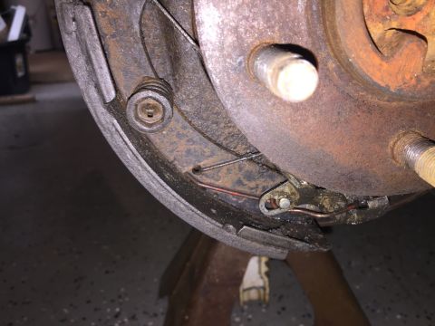 1998 Ford Ranger - Close-up of a vehicle's drum brake assembly, showing signs of wear and rust.