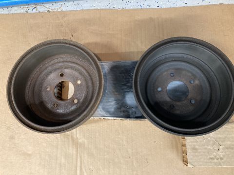 1998 Ford Ranger - Pair of brake drums shown on a mounting bracket.
