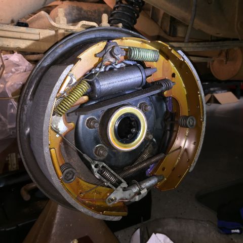 1998 Ford Ranger - Close-up view of a vehicle's drum brake assembly, showing the brake shoes, springs, and wheel cylinder.