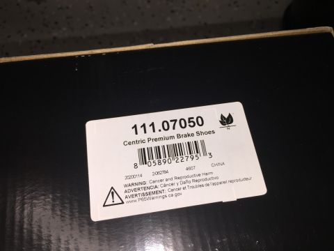 1998 Ford Ranger - A close-up of a box label for brake shoes, showing the product number and warnings.