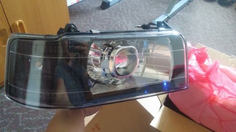 1996 Ford Bronco - A single aftermarket headlight assembly is shown, not a complete vehicle.