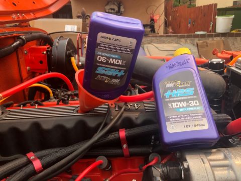 1992 Jeep Wrangler - Changing the oil on a vehicle, with two bottles of HPS 10W-30 high performance synthetic motor oil.