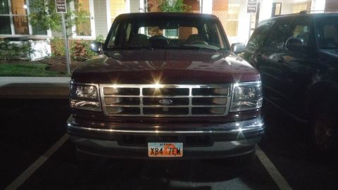 1996 Ford Bronco - Front view of a 1996 Ford Bronco, showing its grille and headlights.