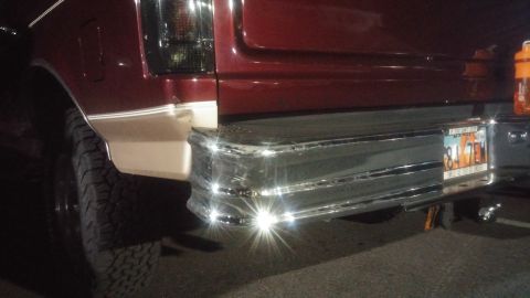 1996 Ford Bronco - Rear view of a maroon 1996 Ford Bronco, showing its chrome bumper and license plate.