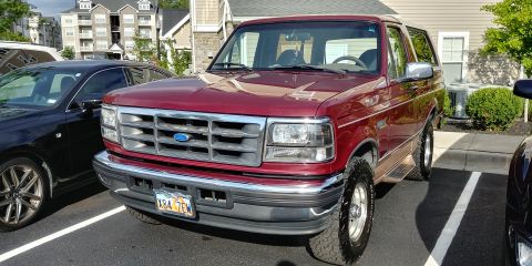 1996 Ford Bronco - This 1996 Ford Bronco is parked in a lot next to another vehicle.